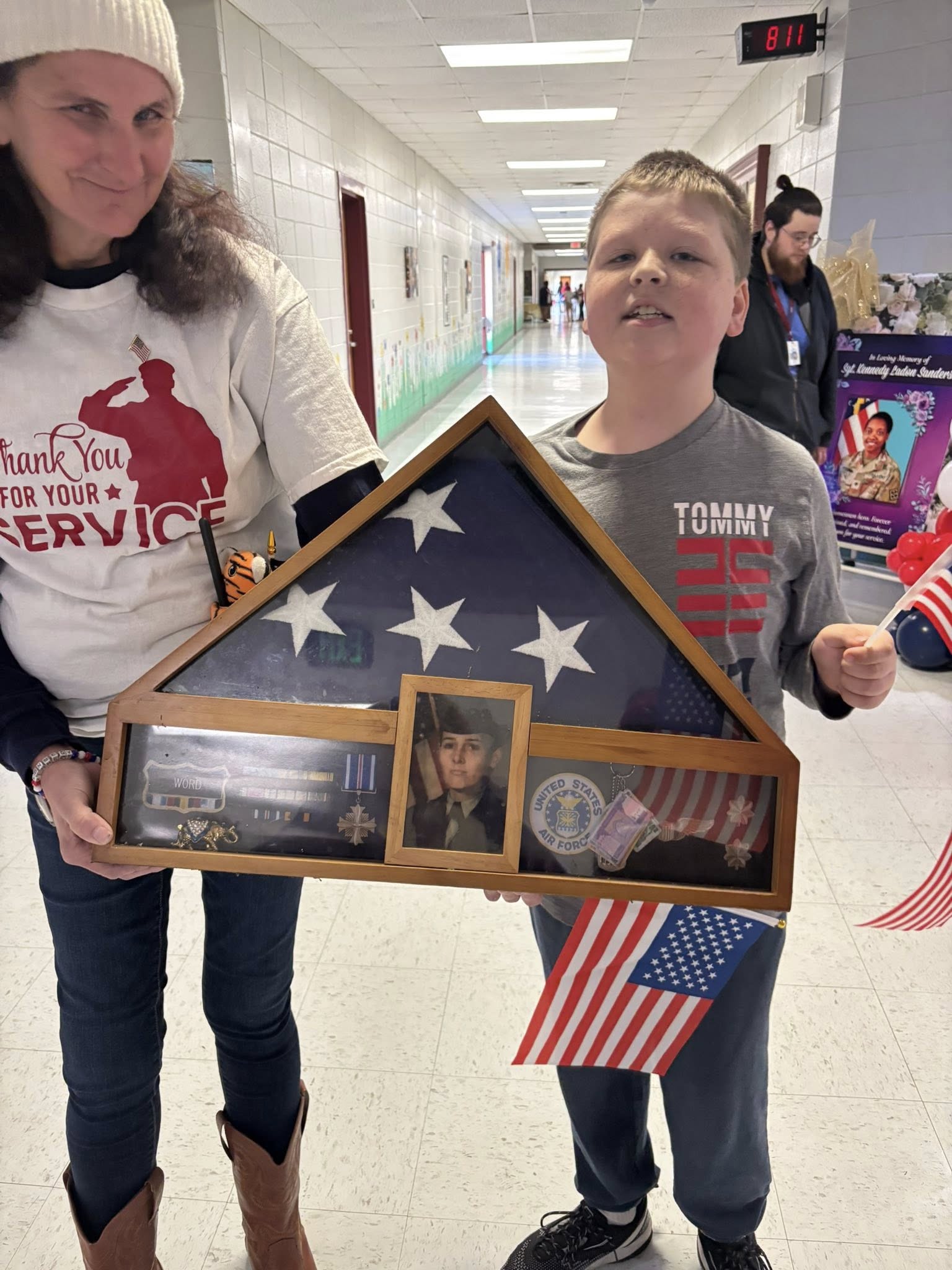 Student holding memorial flag case